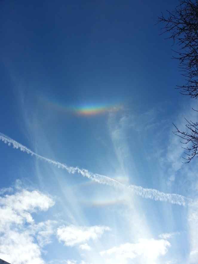 No rain & not a cloud in the sky...But there were definitely beautiful rainbows peering down on us as we waited in line!